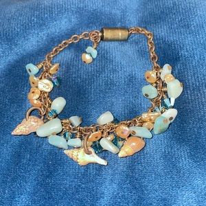 Brass and natural stone seashell charm bracelet with pearl accents